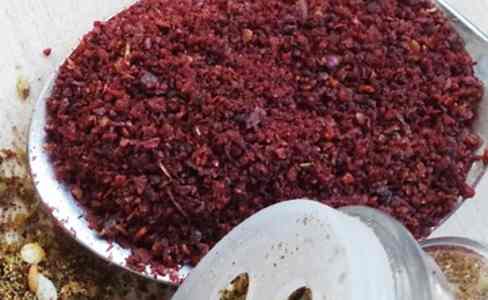 The red sumac spice is mainly cultivated from the Syrian sumac (Rhus coriaria) and is commonly used in Middle Eastern cuisine and other spice mixtures such as za’atar (on the left)